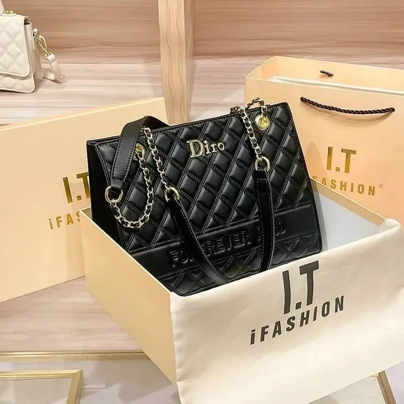Black quilted handbag in box